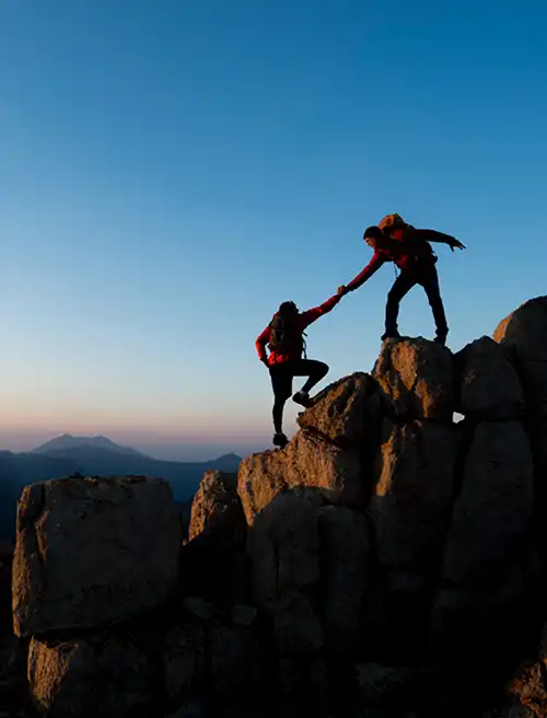 2 people hiking on mountain