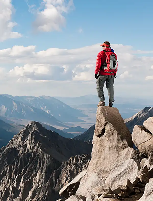 standing on mountain peek